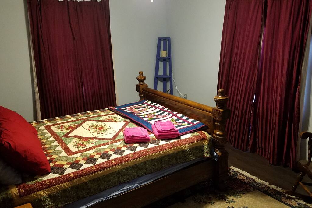 The Rose Room has a queen sized bed and two windows. It also has a large walk-in closet.