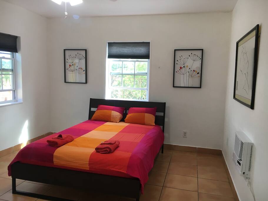A queen-sized bed and AC