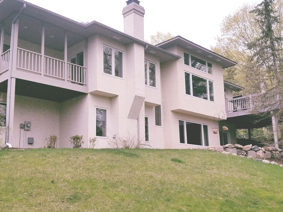 Two-story walkout with large upper deck (right) and smaller coffee nook deck of Master suite (left)