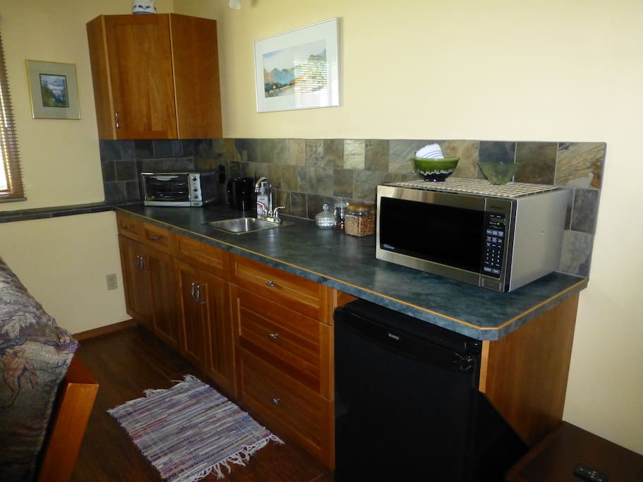 The kitchen has microwave, toaster oven, hotplate, coffee maker etc.