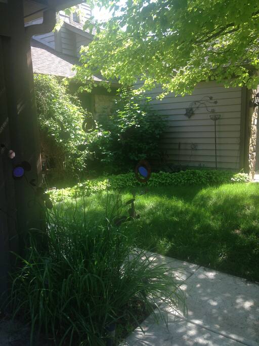 Follow the sidewalk to the front entrance.