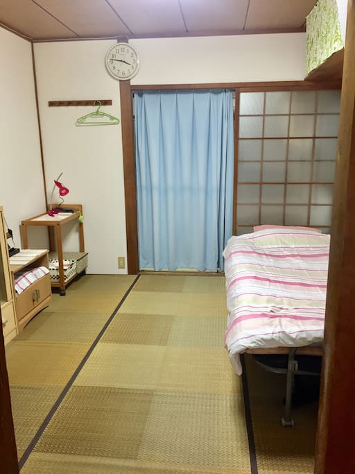 Bedroom downstairs with a single bed, TV and a DVD player
Another set of futon can be spread next to the bed