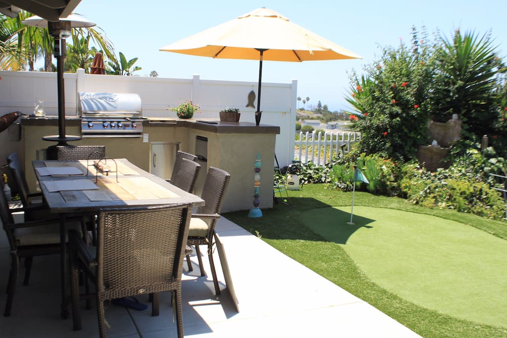 Large outdoor dinning table (fits 8) and built-in gas powered BBQ w/ outdoor countertops and mini-fridge.