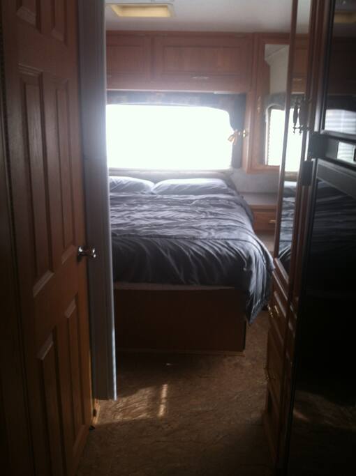 Queen sized private bedroom with separate TV