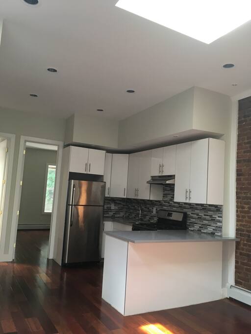 This is a picture of the kitchen/dining area before it was furnished and stocked with brand new appliances. (Before)