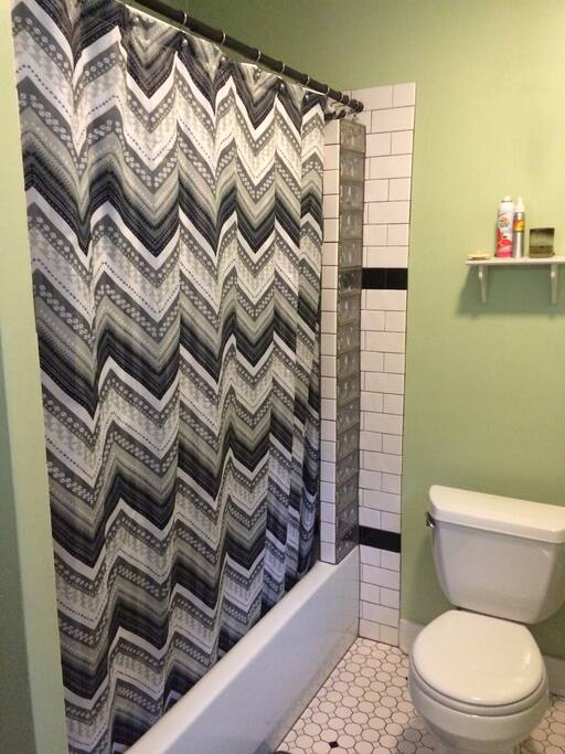 Lovely tiled bathroom with shower