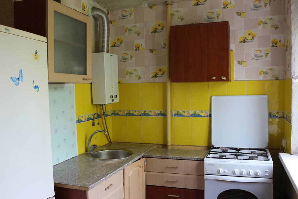 kitchen with stove and fridge