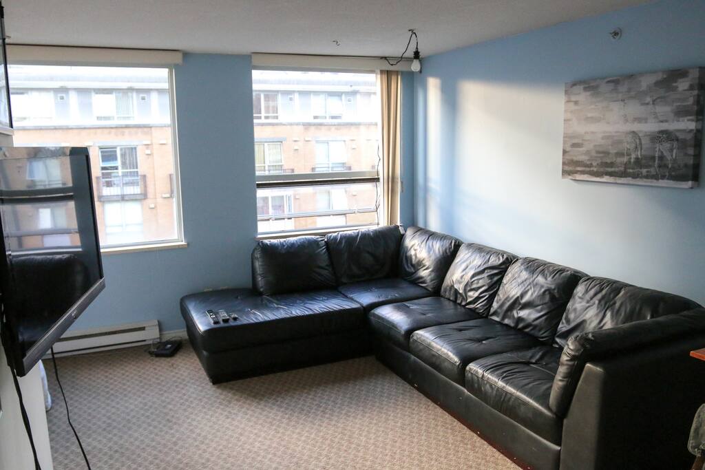 Large super comfy L-Shaped couch/ 42 Inch rotating tv with cable.