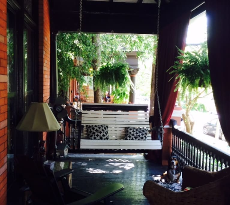 Front porch with a lovely swing - you will often find us out here in nice weather