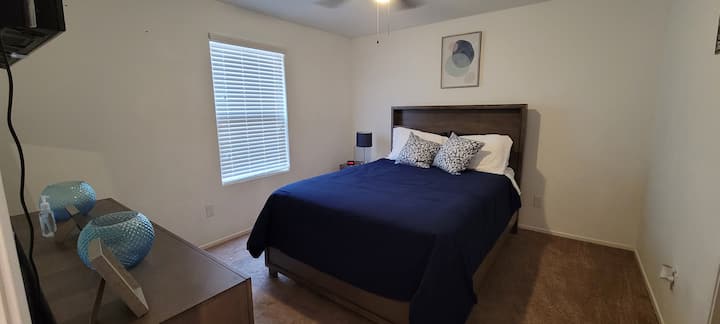 Master bedroom with Smart TV, firm mattress, walk in closet and ensuite bathroom.