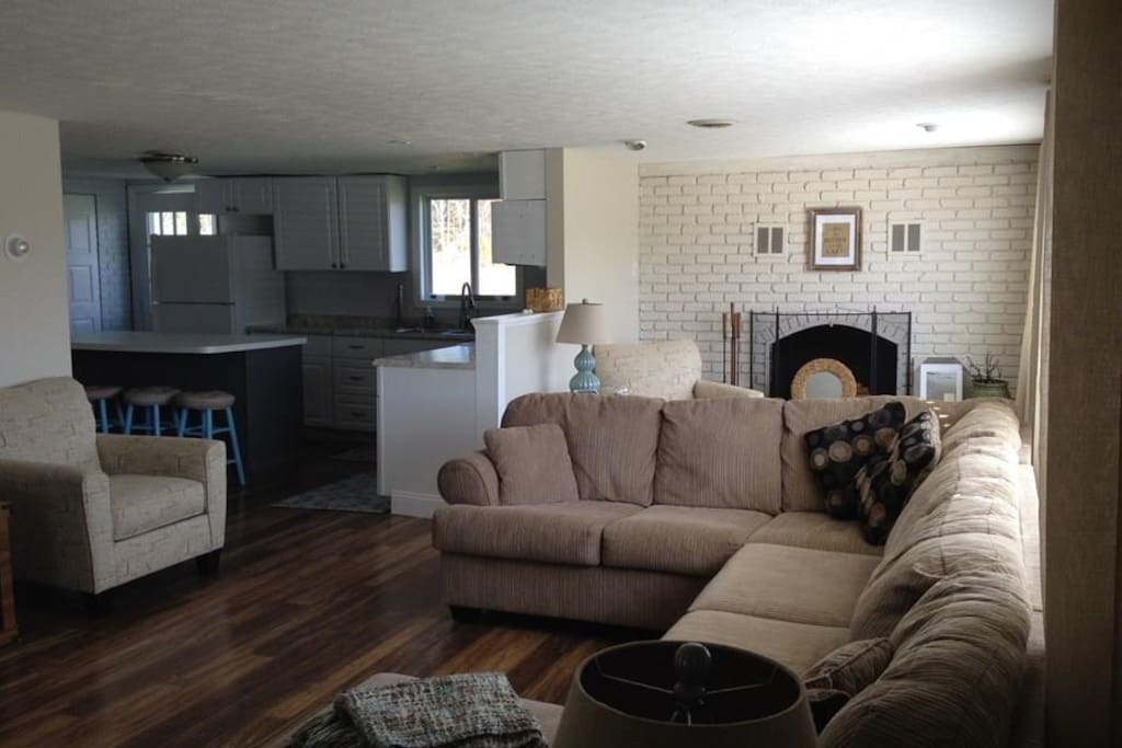 Plenty of seating, fireplace and game table