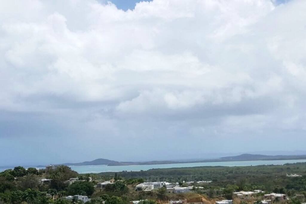 View to the ocean from apartment balcony.
