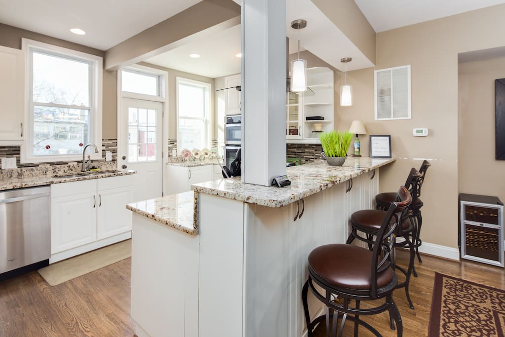 Bar-stool height counter-top into kitchen - with three nice barstools!