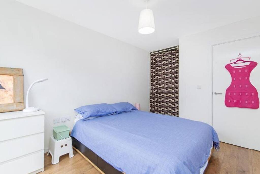 The bedroom has ample room for hanging clothes in the fitted wardrobe