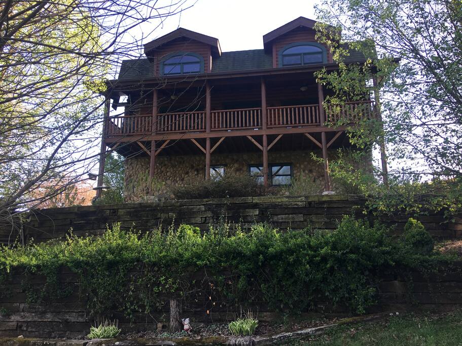 Side view of the house. You would enter the property on the lower unit.