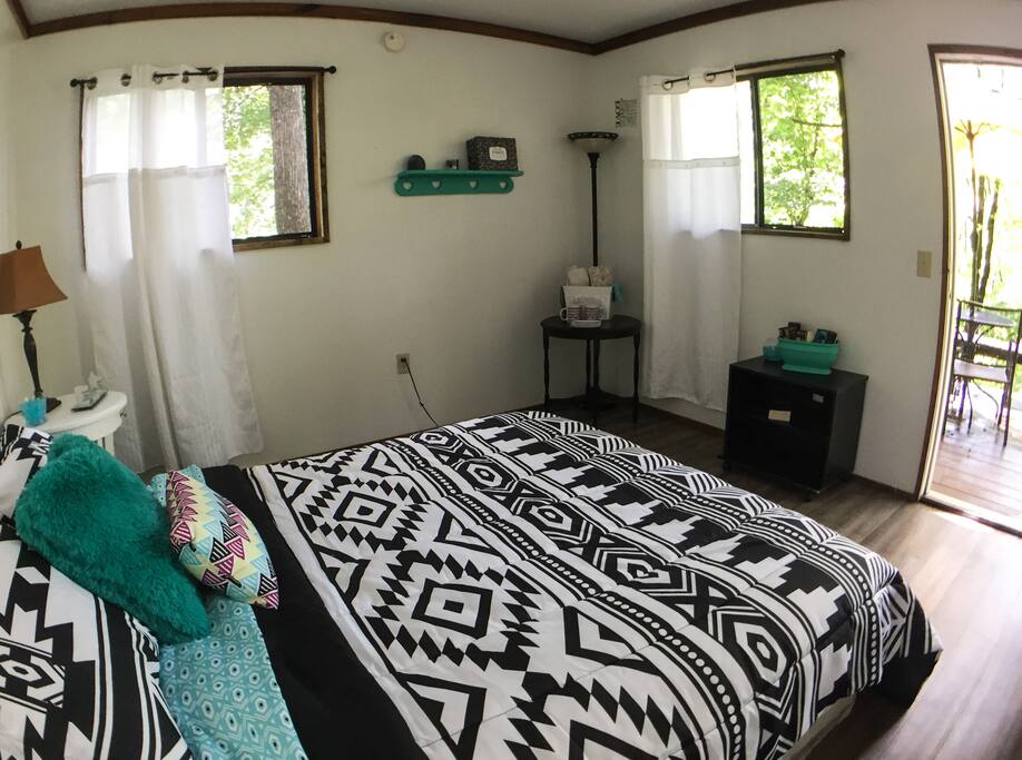 Queen size bed and room for an air mattress.