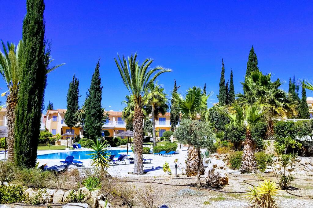 Resort-style complex with 3 swimming pools and lush vegetation