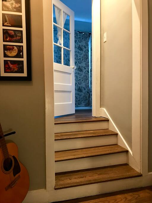 Entrance to your room. White curtain on the window is there for privacy. You can let it down once you check in!