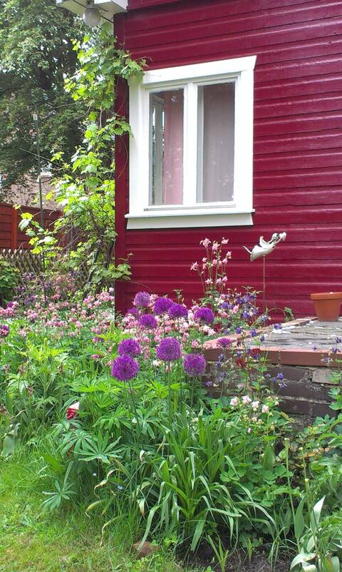 Red wooden house near two lakes and close to Berlin