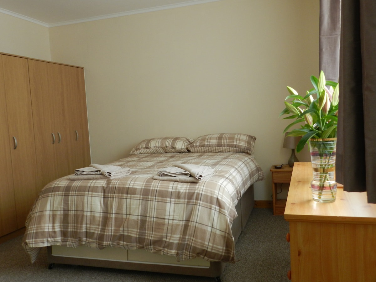 Bedroom 1 is a double bed with en-suite shower room. The lovely large window look out onto the garden area.