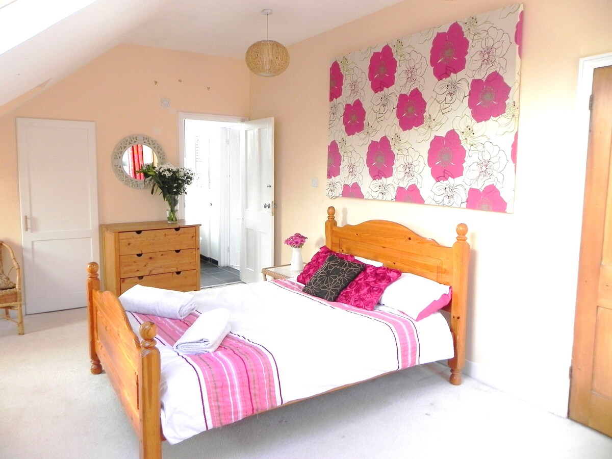 This second floor bedroom has a walk in wardrobe and a Jack and Jill en suite