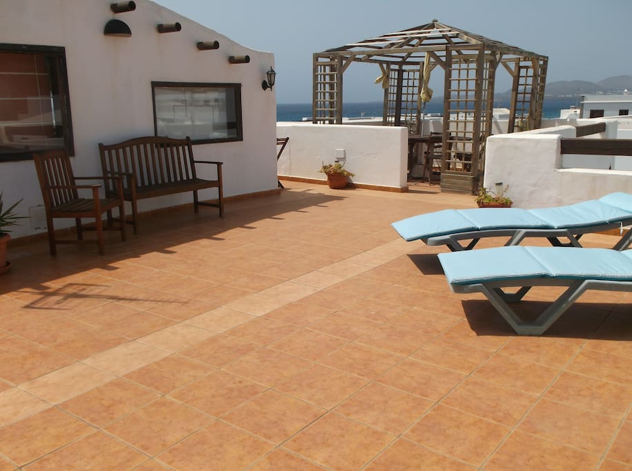 Roof top lounge leading out to the roof terrace with beautiful sea views