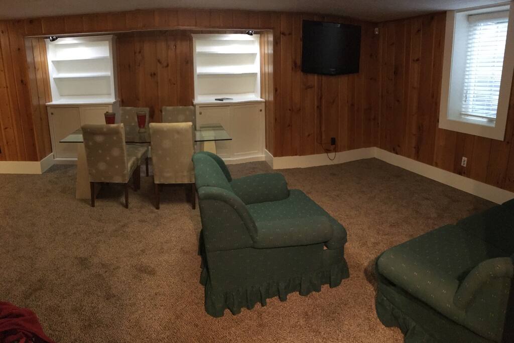 Large family room with formal dining table. There is lots of space outside of the bedroom for additional sleeping areas or just relaxing