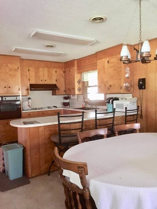 Kitchen is roomy and has all the necessary appliances and dining needs!