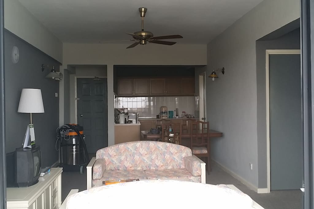 Living room with adjacent dining and kitchen