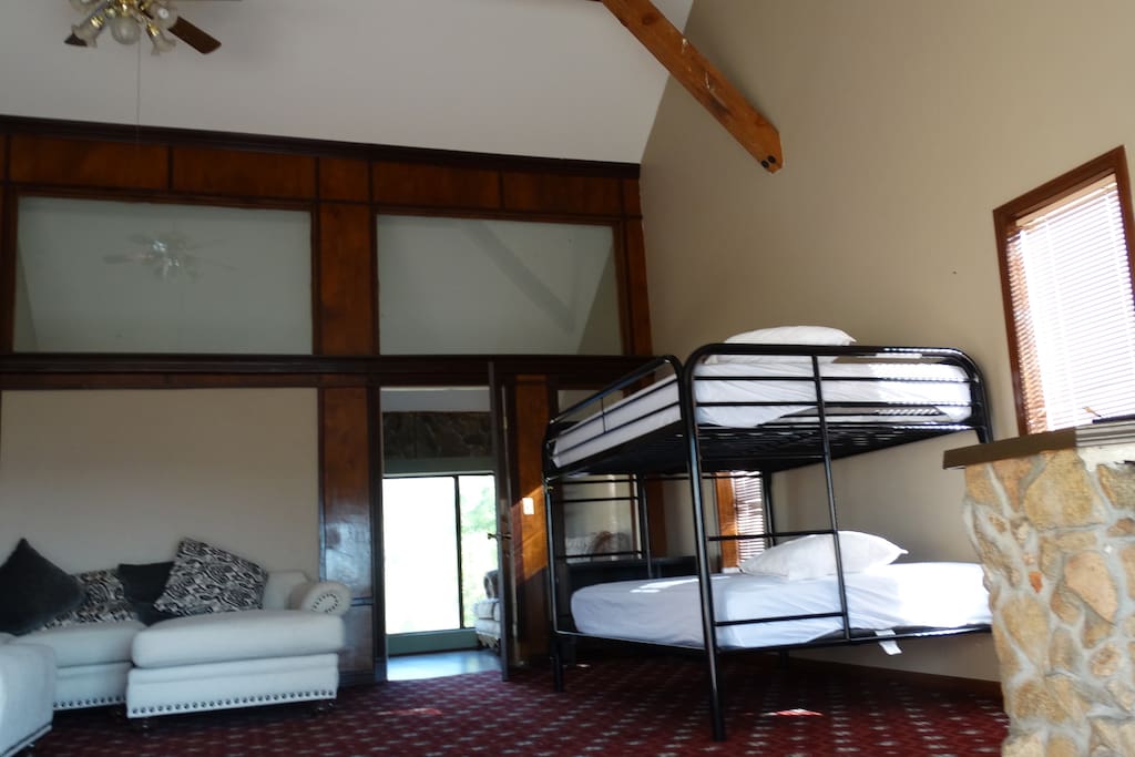Bunk beds and a spacious couch in the living room.