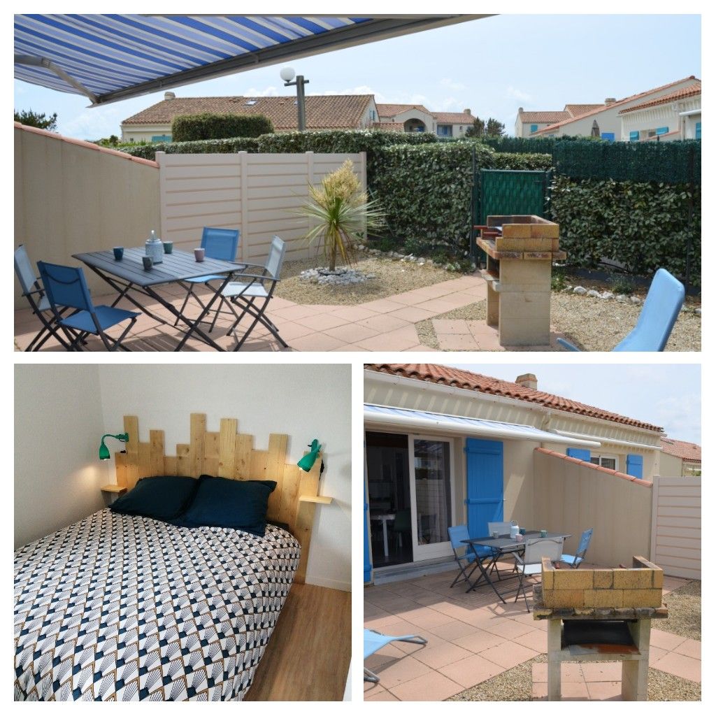 An outdoor space features a dining table with four chairs, surrounded by gravel and greenery. A barbecue grill stands nearby, with a shade awning overhead. Inside, a sleeping area showcases a patterned bedspread on a spacious bed, complemented by two bedside lights. Sliding doors provide access to the patio.
