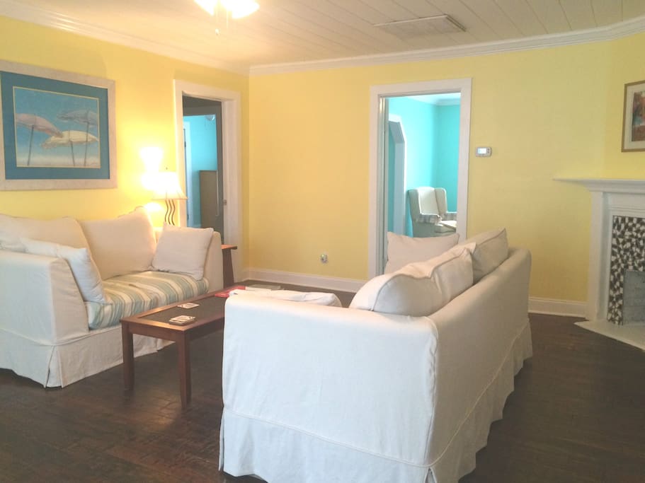 The living room is spacious with comfortable seating