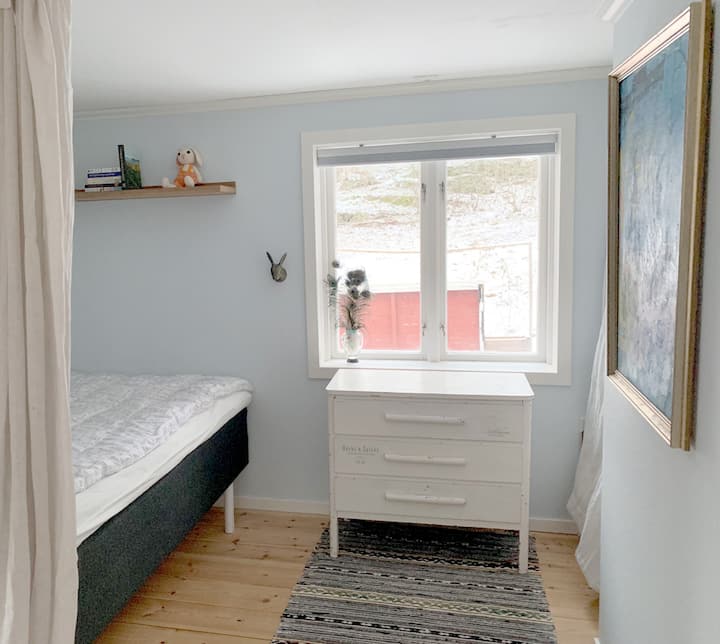 The bedroom with a large double bed and closet.