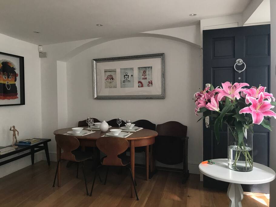 Dining area in living room and front door