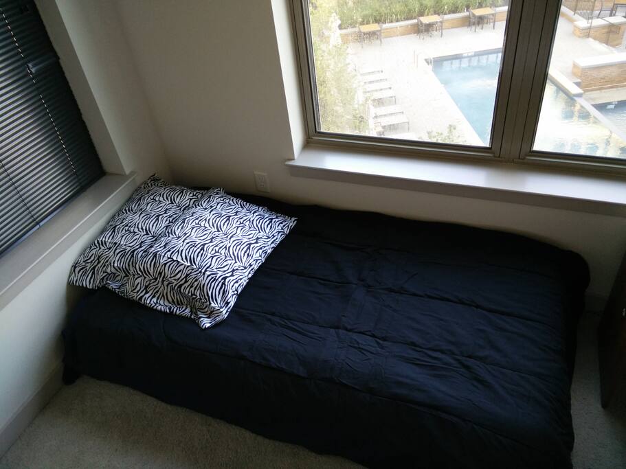 That's the bed in daylight and the view from the bedroom window on the right.
