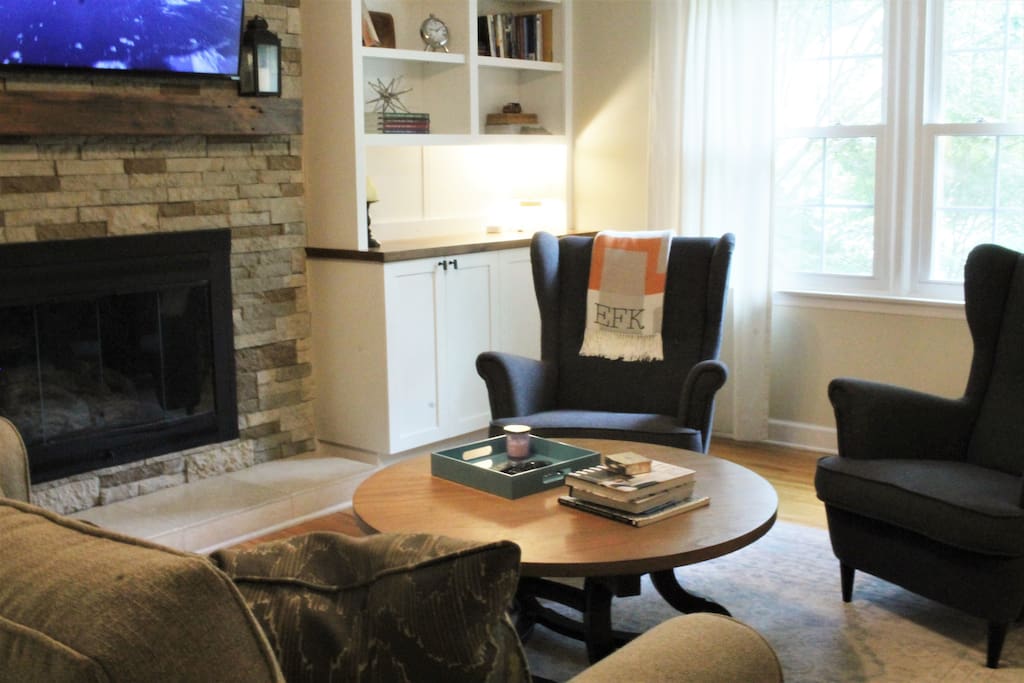 Den equipped with Apple TV, gas fireplace and ample seating.