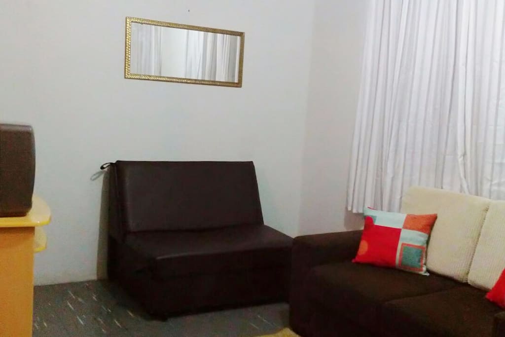 Sofá cama na sala