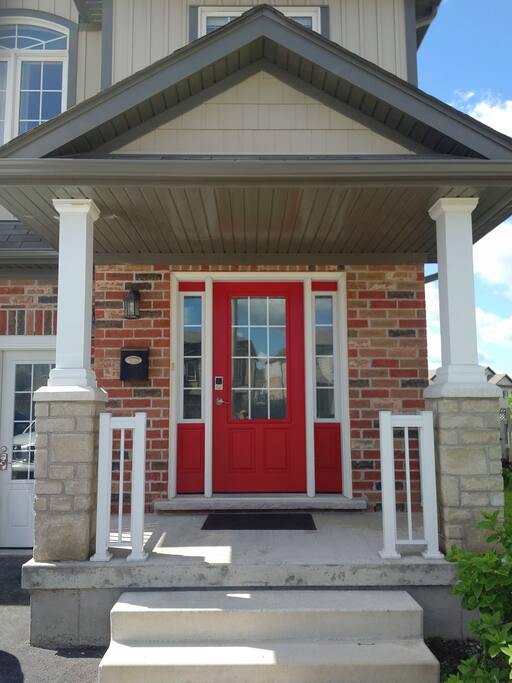 Front Door with access through digital door lock and traditional lock & key.