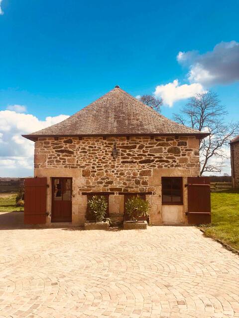 Wood and stone cottage close to the sea.