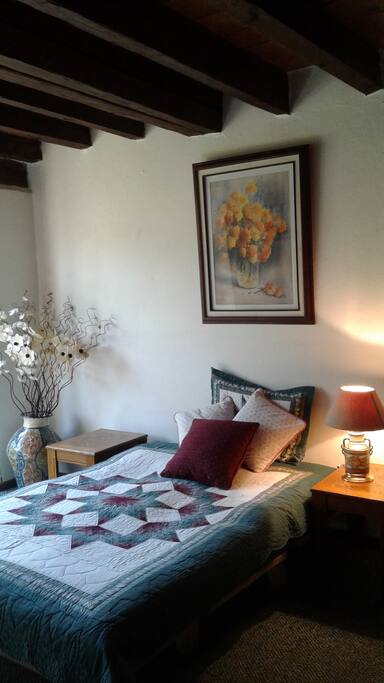 This bedroom features a comfy double bed with a futon mattress.