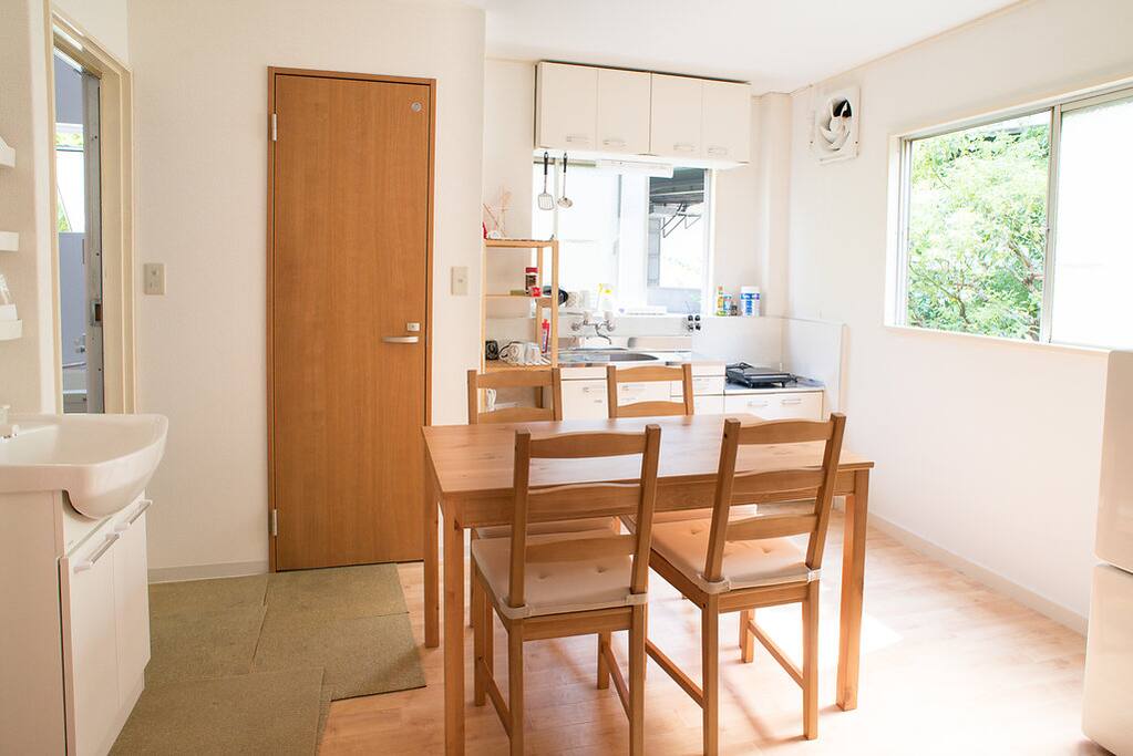 Dining room and kitchen with many windows! So bright!
