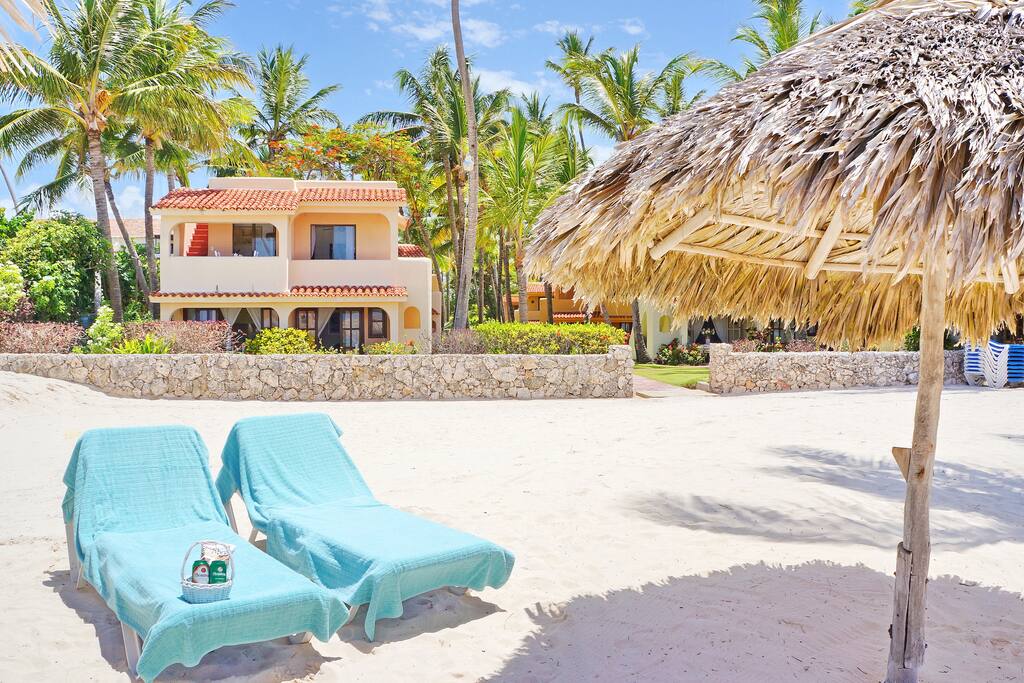 Our beach with free of charge umbrellas and loungers