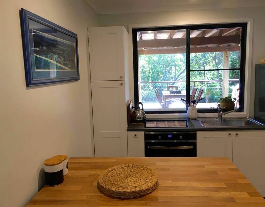 Kitchen opens onto large deck for additional dinning space and relaxing.