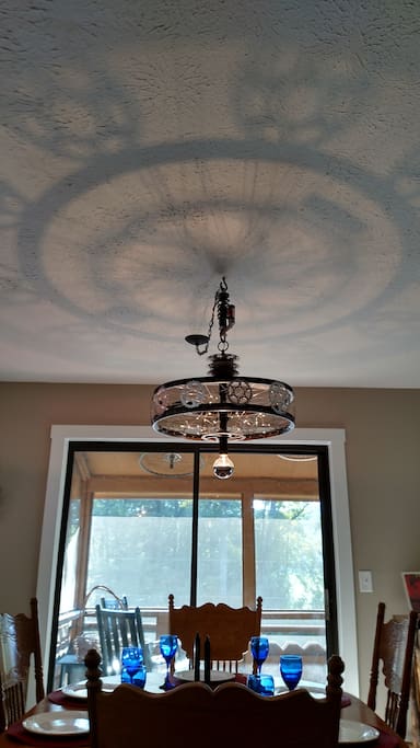 Custom Made Chandelier made from bike parts casts an amazing reflection onto the ceiling. Enjoy custom touches throughout this home!