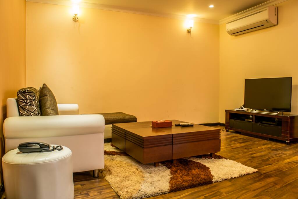 Spacious Living Room with TV