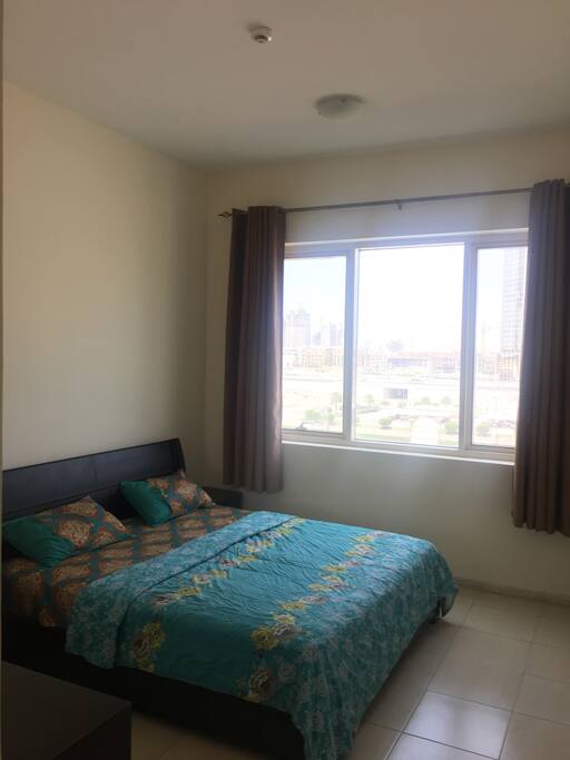 The Bedroom, clean, tidy and bright, with attached bath and built in cupboards.