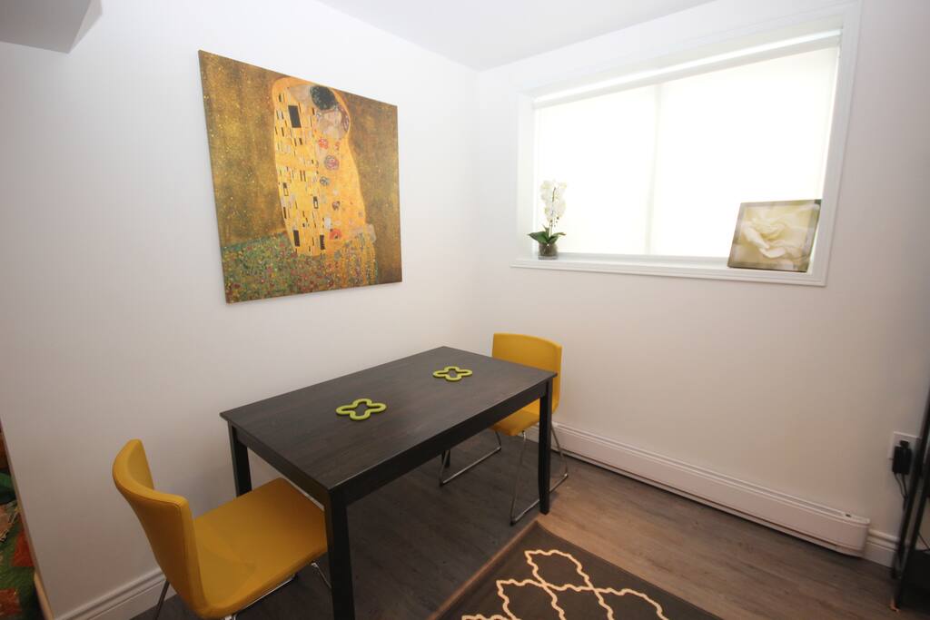 Dining room with lots of light and modern decor.