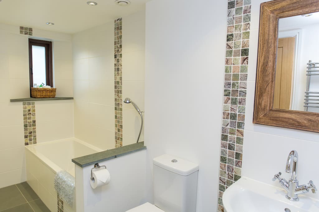 Spacious en-suite with separate shower and bath.