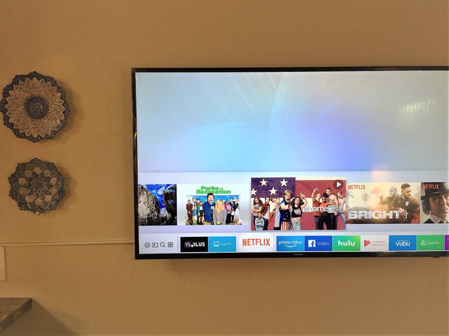 Samsung 49'' TV for you to browse and watch. Netflix is set!