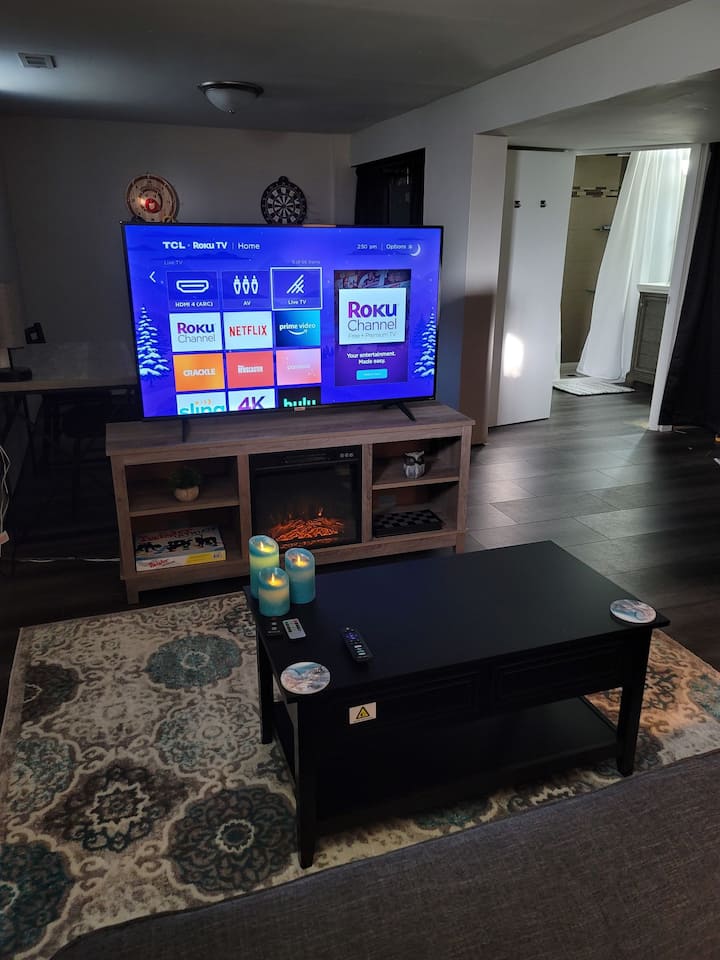 Basement can be used as a bedroom or 2nd  living area. Has the washer and dryer, full bathroom, desk work area, wall games, board games, fireplace, 55 inch smart TV, Futon, and lift top table.